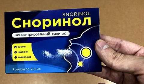 Фотография упаковки Сноринола в руках мужчины